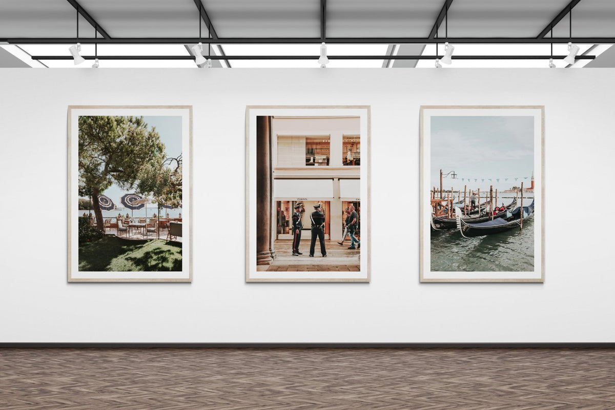 Three framed travel photographs displayed together on a white wall