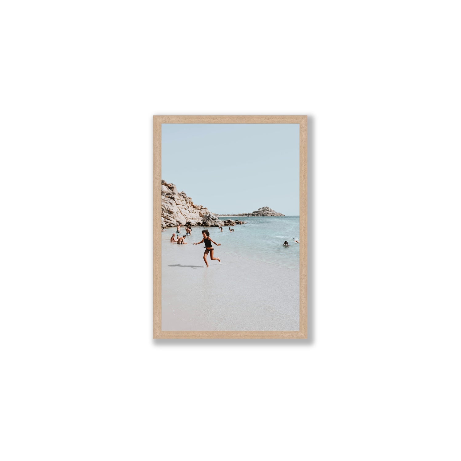 Skipping Angel Mykonos Greek island decor wall art Medium full-bleed fine art print in natural oak frame