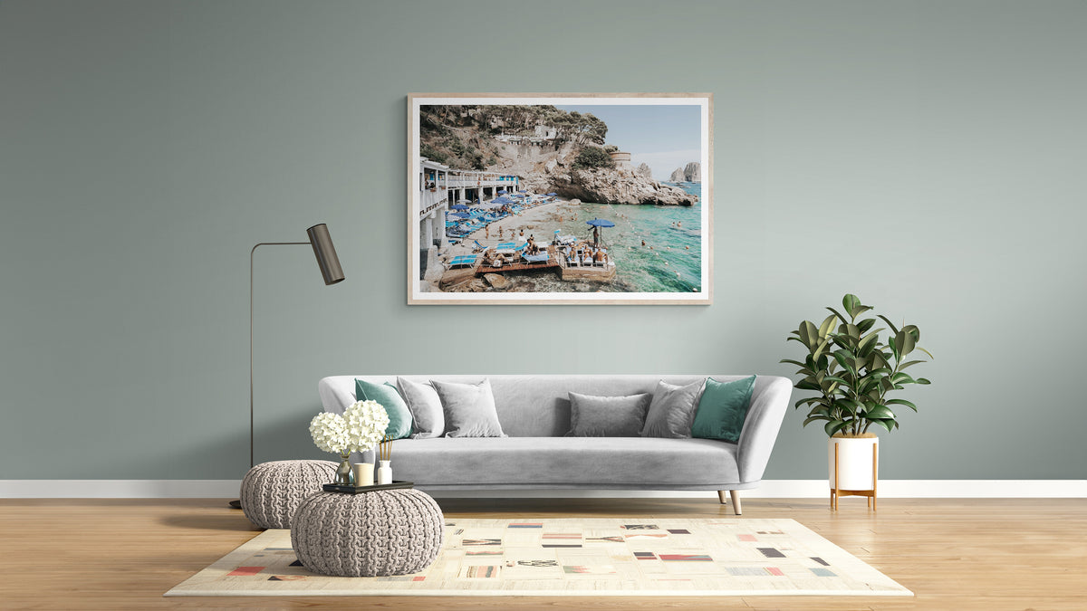 Framed Amichi Co photography above a long sofa in a colourful, layered Eclectic Chic living room