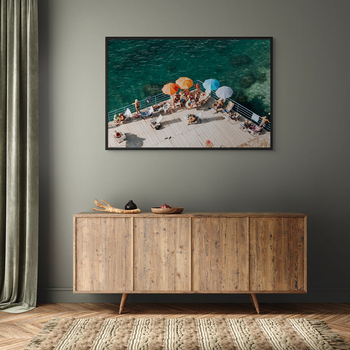 Il Dolce Far Niente Sorrento fine art print in a black frame, styled on an olive-green wall above a timber sideboard