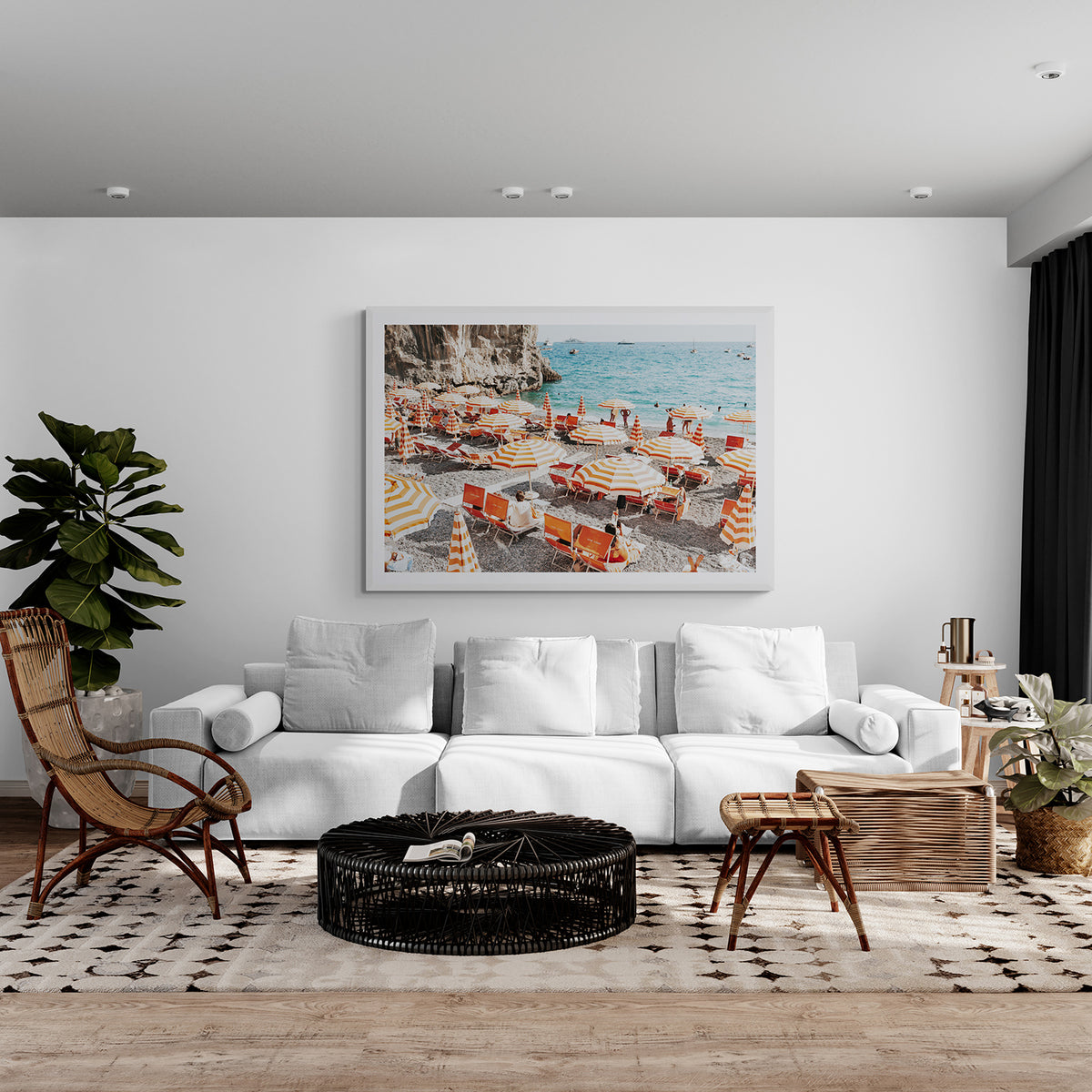 Mango Sorbet Positano fine art print in a white frame, styled above a white sofa with a woven coffee table and rattan chair