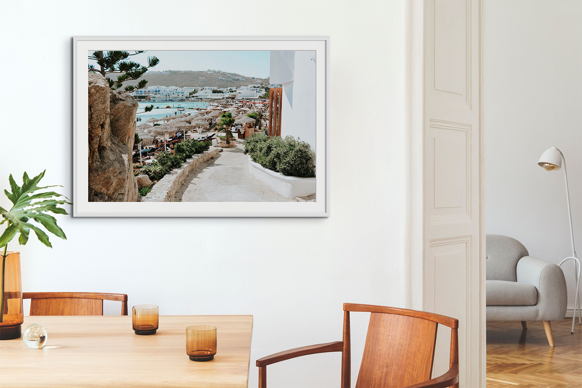 All Roads Lead To The Beach fine art print in a white frame styled in a warm dining room