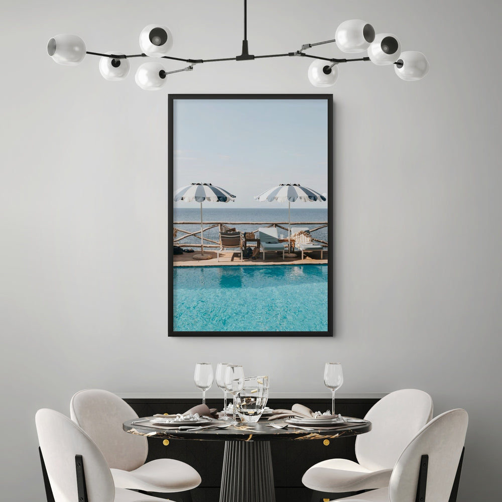 Lifestyle image of Beach Retreat fine art print, Ischia, Italy, european beach clubs artwork, 01 beach retreat black full bleed styled in a room