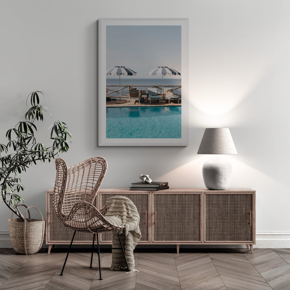 Lifestyle image of Beach Retreat fine art print, Ischia, Italy, european beach clubs artwork, 02 beach retreat c white frame 2 styled in a room