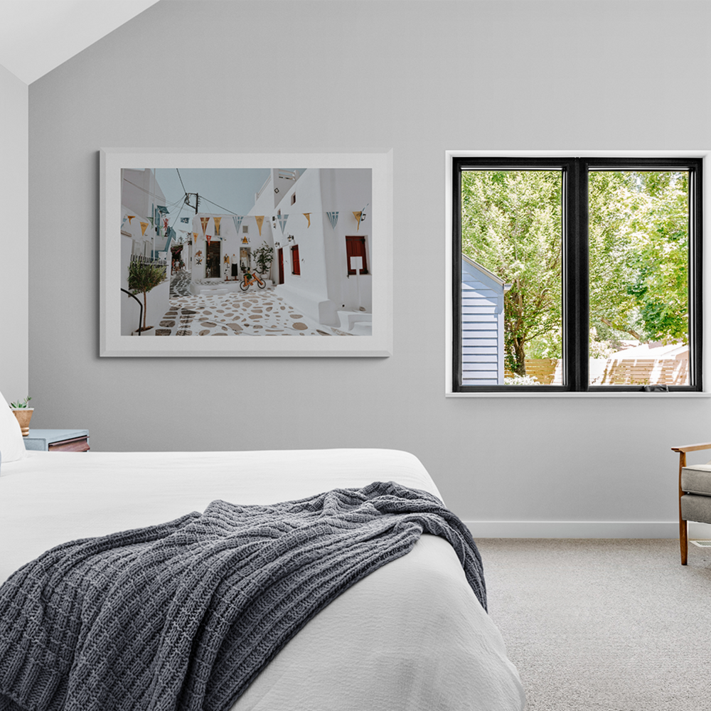 Cruising The Streets Mykonos Greek island wall art framed print styled in a room view 3