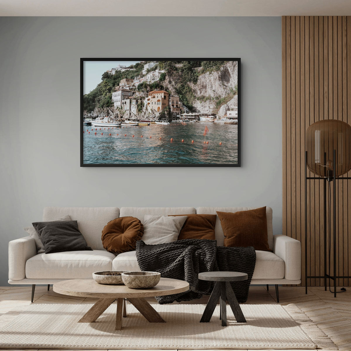 Product mockup of Amalfi Villas full-bleed fine art print in black frame styled in a room