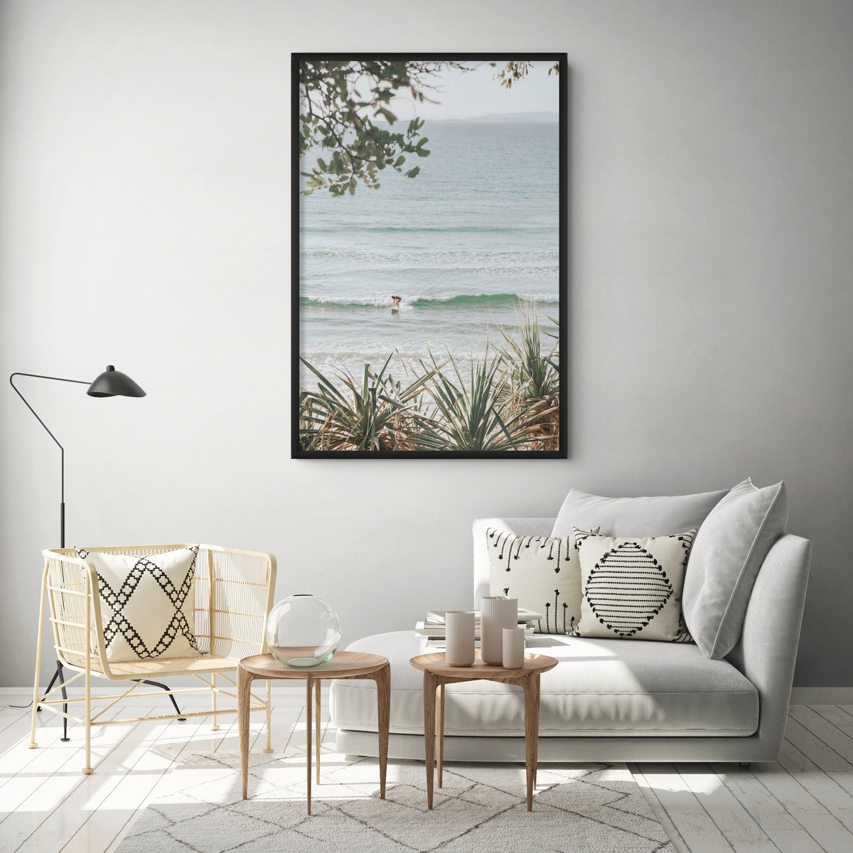 Product mockup of Dream Boat full-bleed fine art print in black frame styled in a room