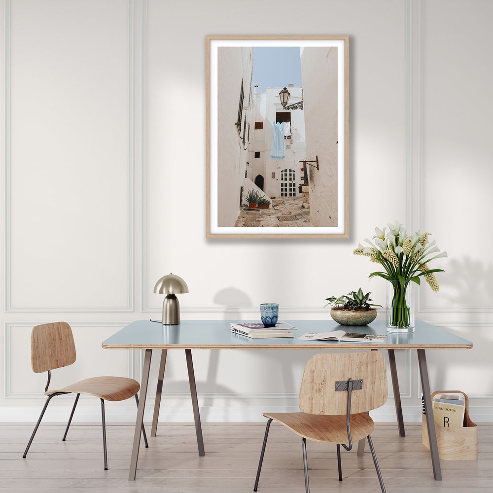 Laundry Day Puglia Ostuni Italian wall art natural oak framed print styled in a room