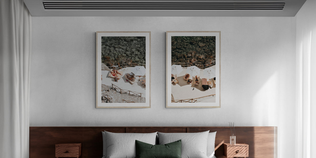 Lounge Lizards and When Harry Met Sally artworks styled together above a bed