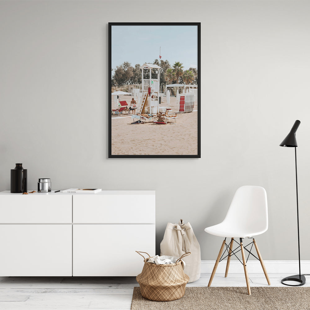 Red Lounge Reverie Puglia beach coastal wall art black framed print styled in a room