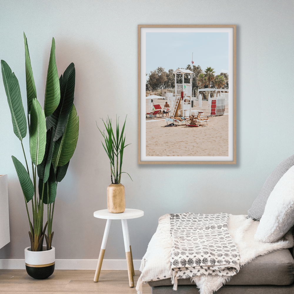 Red Lounge Reverie Puglia beach coastal wall art natural oak framed print styled in a room