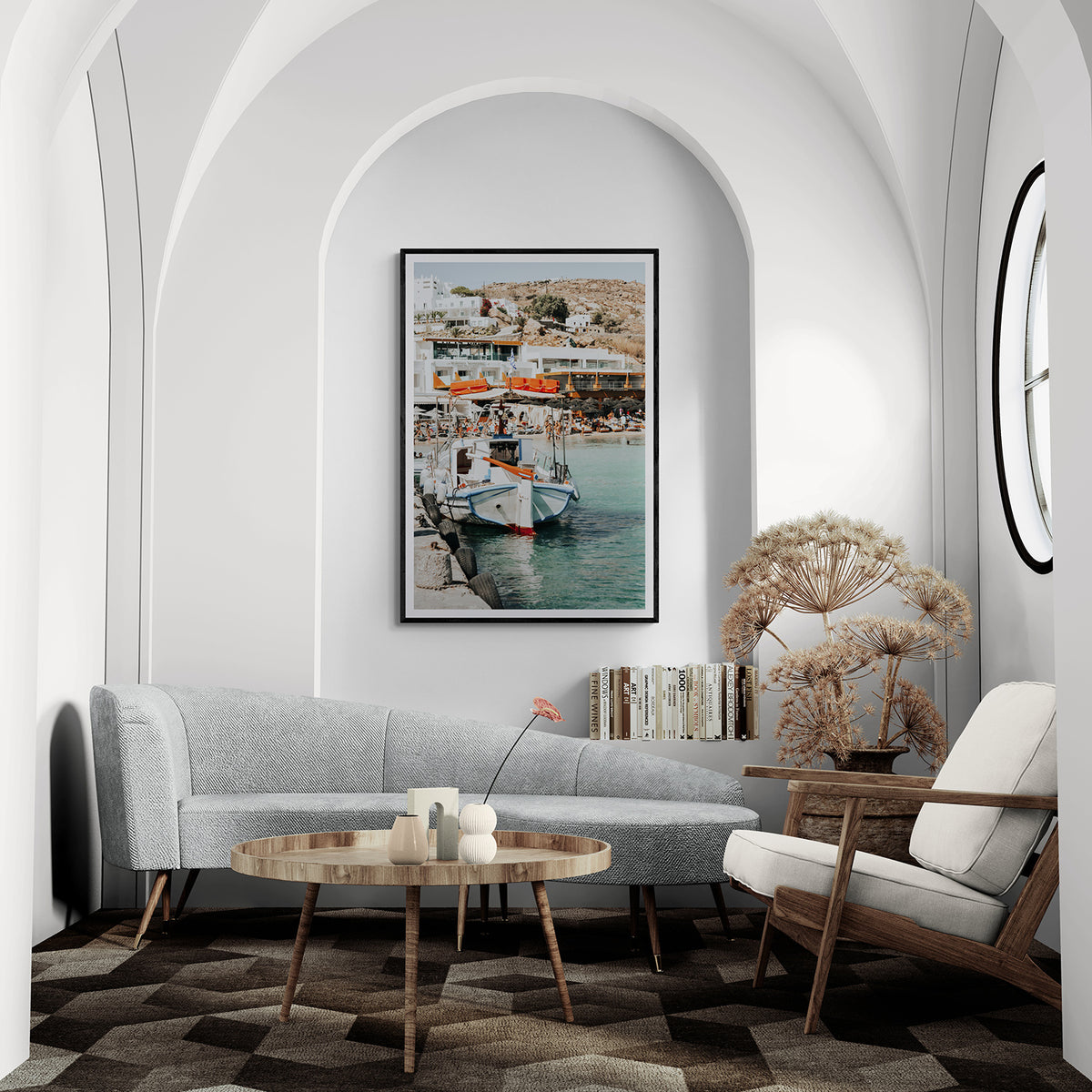 Travel In Style Mykonos fine art print in a black frame styled in an arched living room with a curved sofa