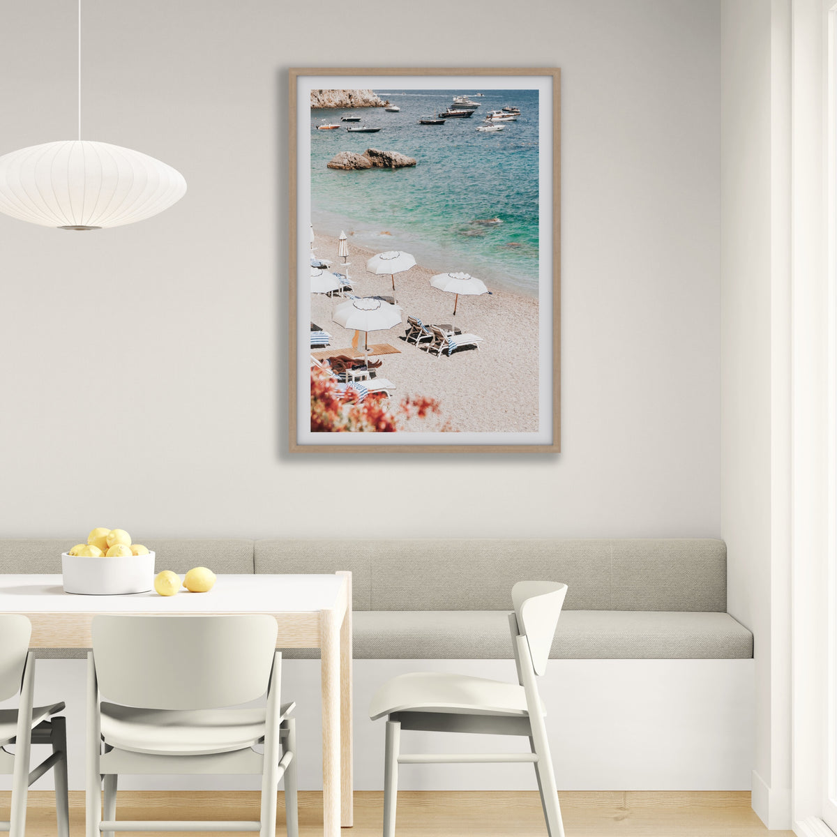 Romantic Escape Amalfi, pebbled Amalfi beach with white umbrellas and turquoise sea, framed print styled in a room view 4