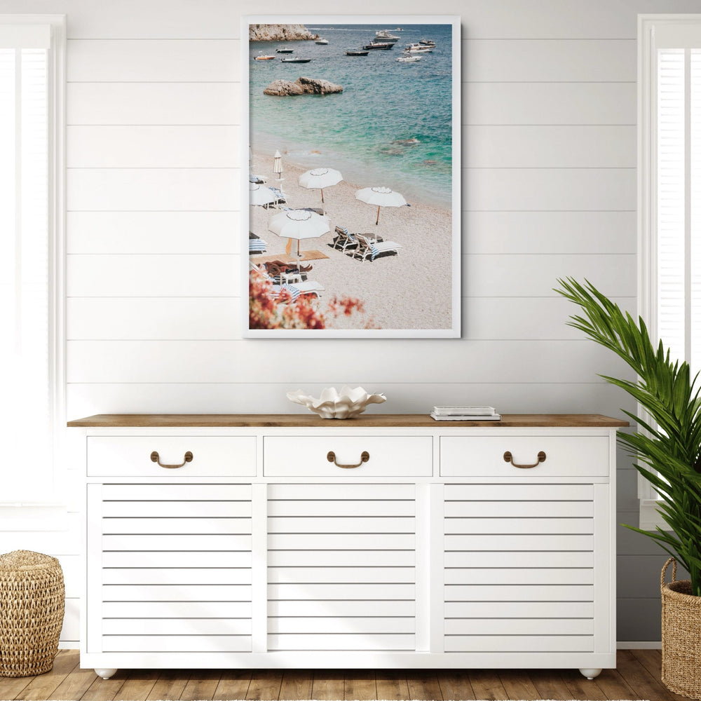 Romantic Escape Amalfi, pebbled Amalfi beach with white umbrellas and turquoise sea, framed print styled in a room view 5