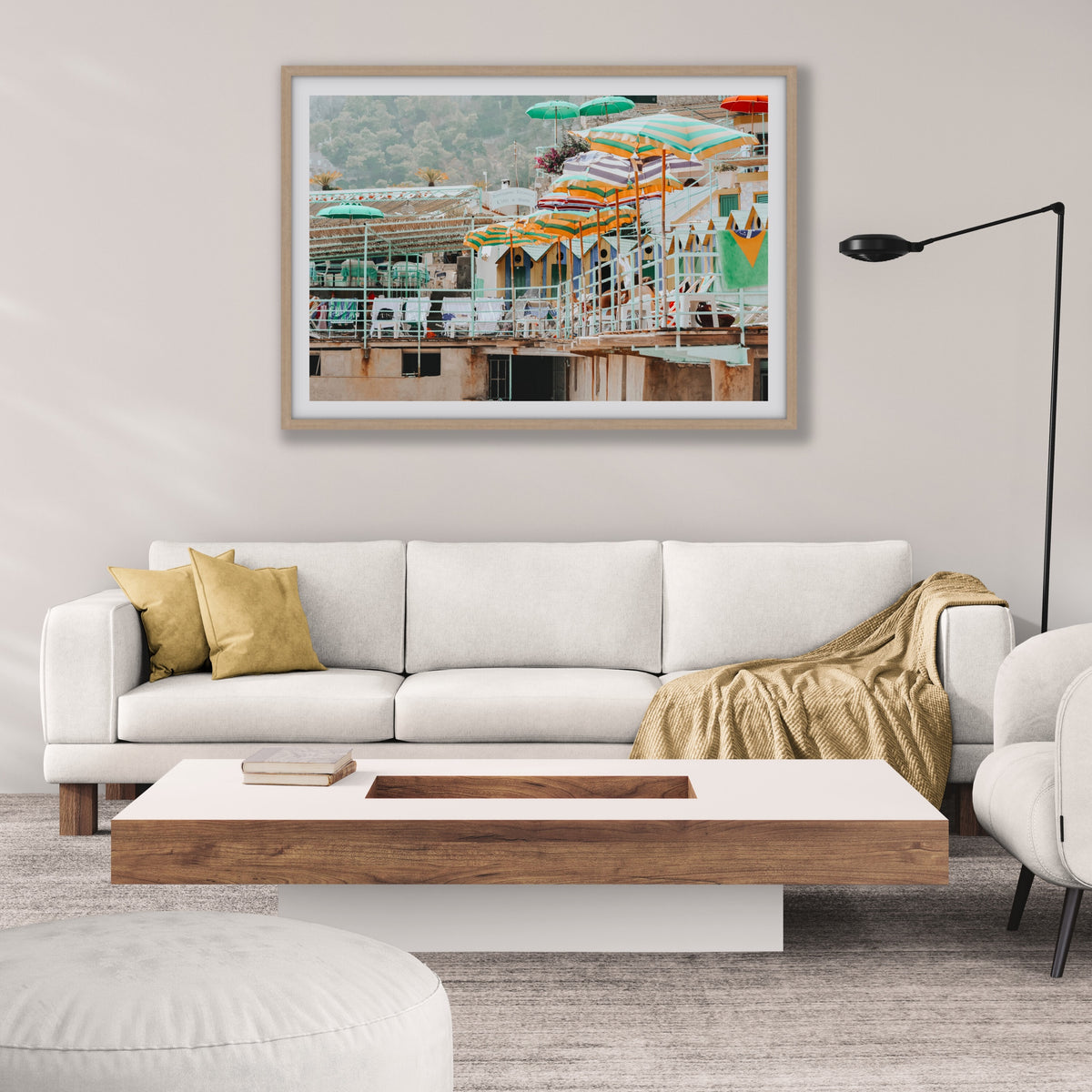 Terrace Tableau Capri, faded striped umbrellas above pastel beach huts on a terrace, framed print styled in a room