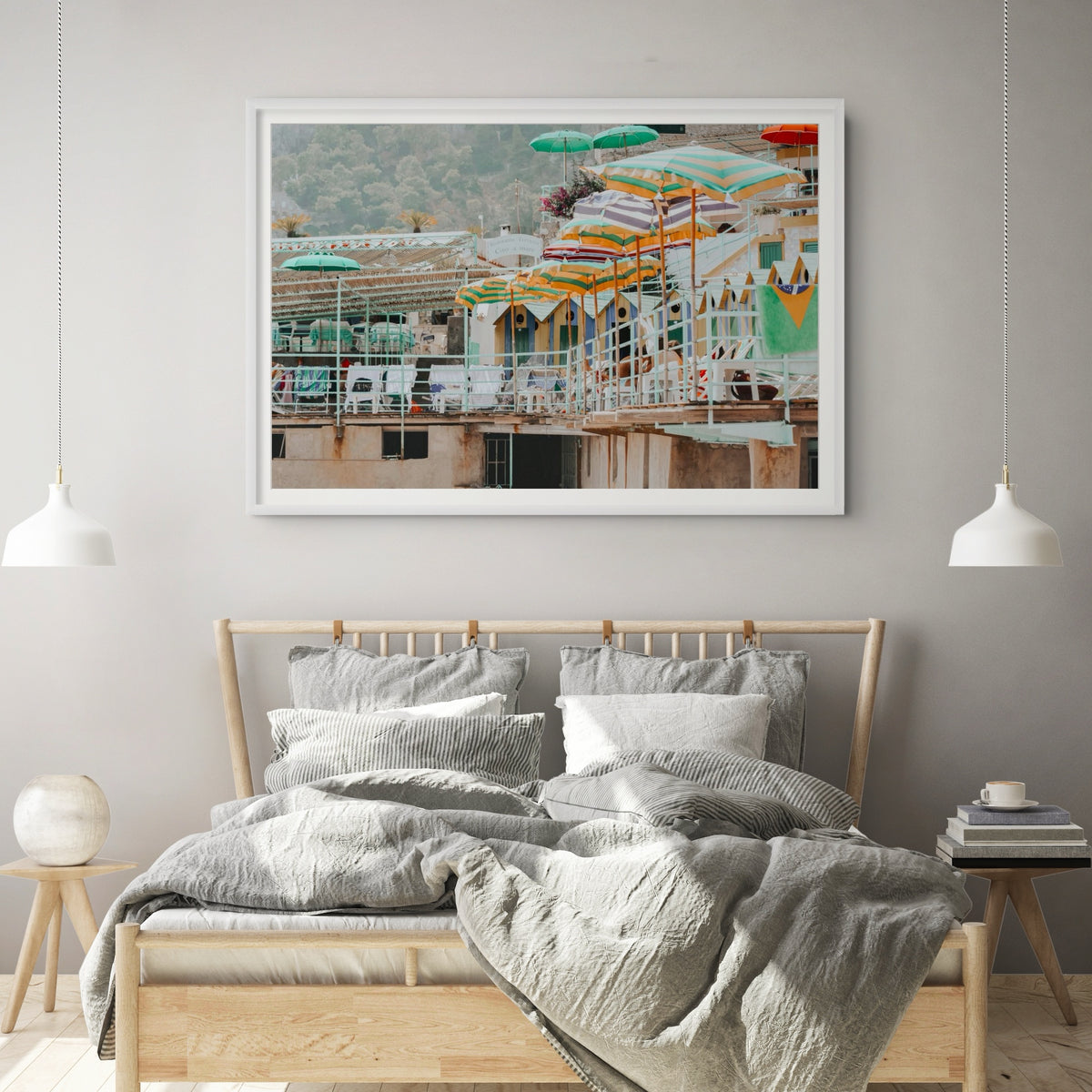 Terrace Tableau Capri, faded striped umbrellas above pastel beach huts on a terrace, framed print styled in a room view 2