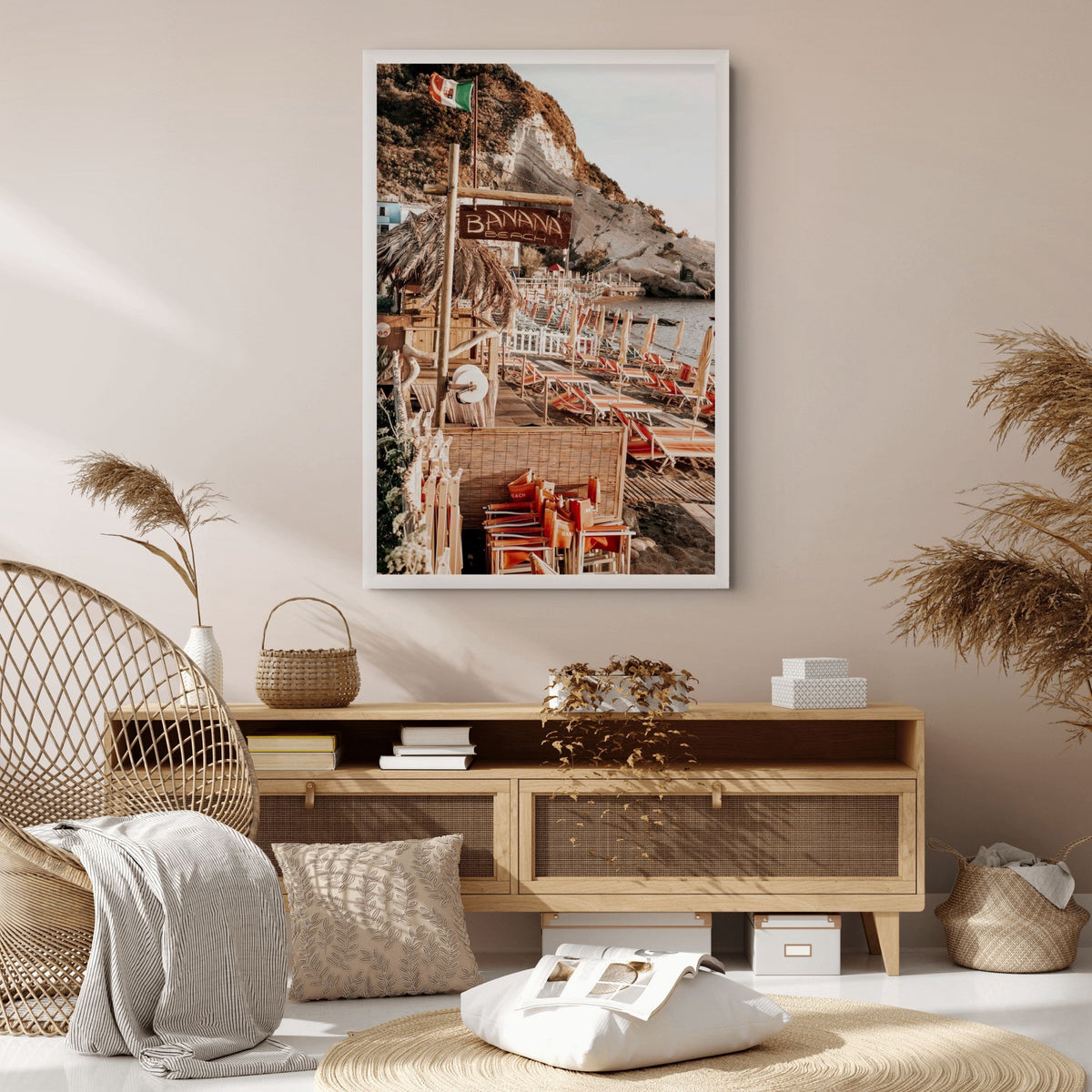 Barefoot Ischia Ischia, Banana Beach sign, striped loungers and stacked orange chairs, framed print styled in a room view 3