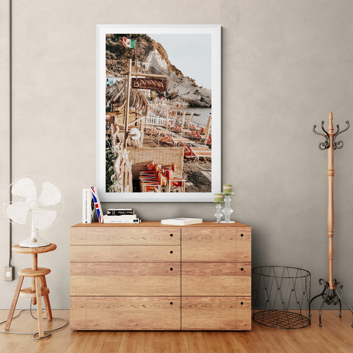 Barefoot Ischia Ischia, Banana Beach sign, striped loungers and stacked orange chairs, framed print styled in a room view 6
