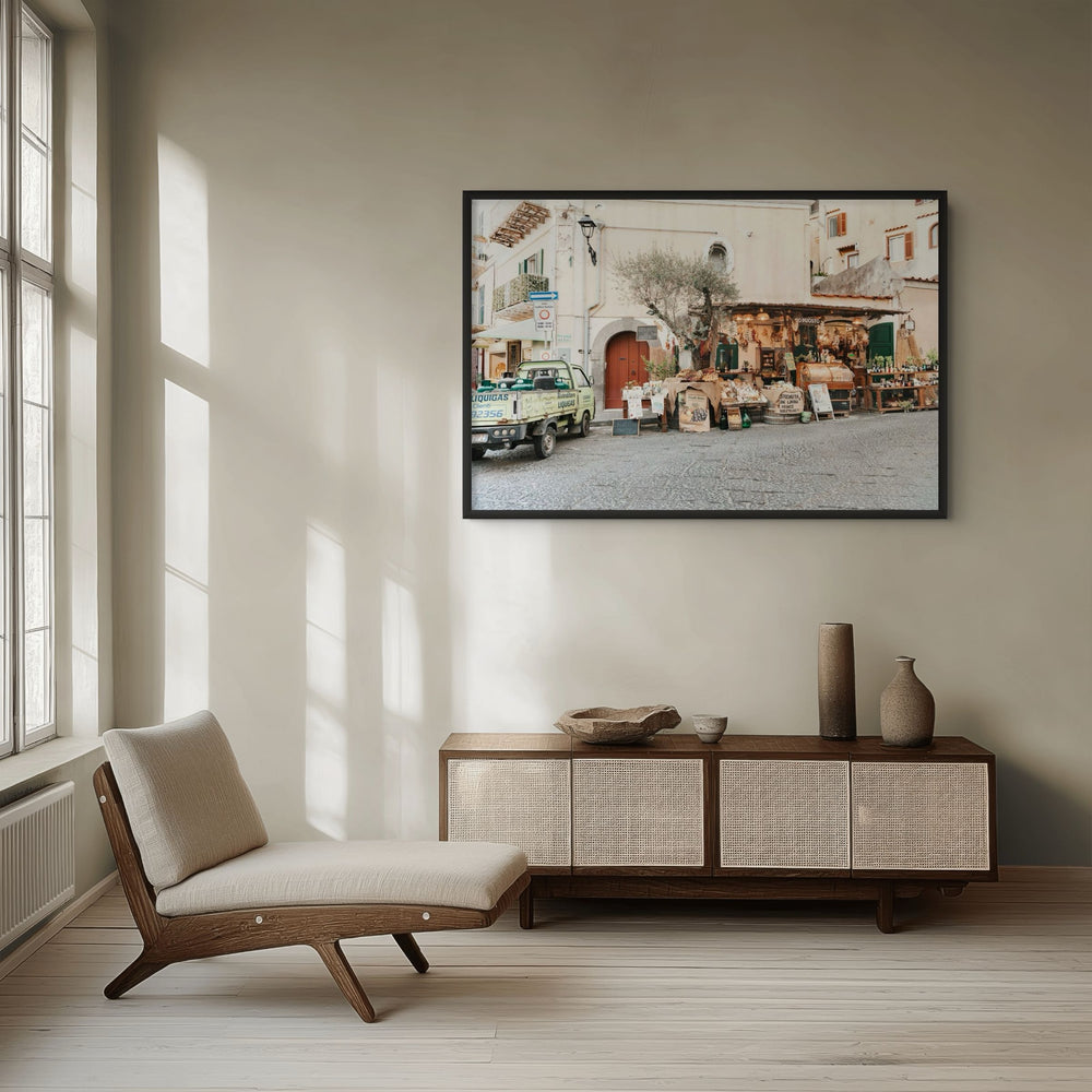Mercatino Ischia, cobbled street market stall with olive tree and green truck, framed print styled in a room view 2