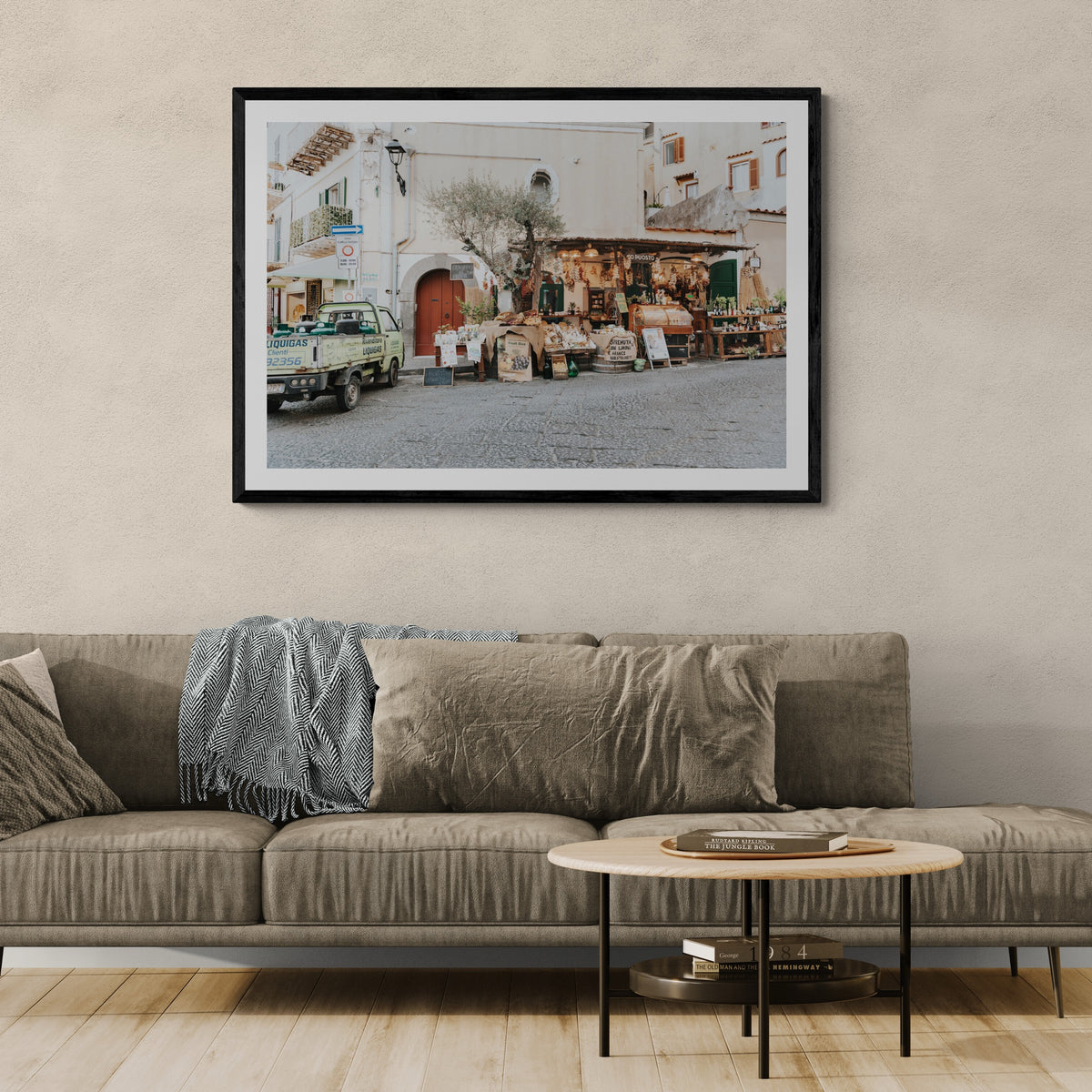 Mercatino Ischia, cobbled street market stall with olive tree and green truck, framed print styled in a room view 3