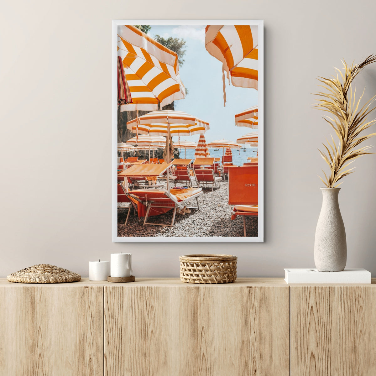 Aperol Summer Positano, orange striped parasols and loungers on a Positano pebble beach, framed print styled in a room
