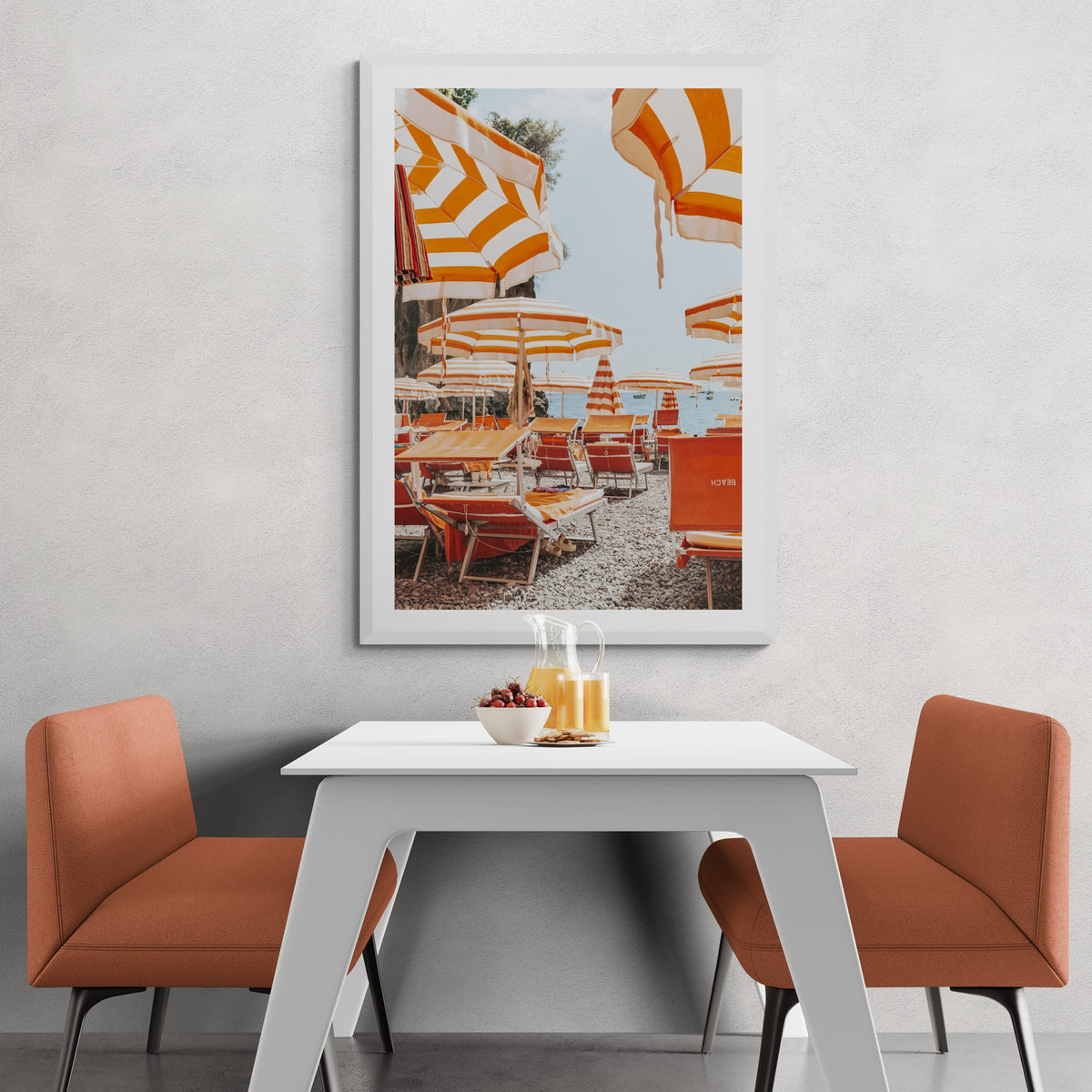Aperol Summer Positano, orange striped parasols and loungers on a Positano pebble beach, framed print styled in a room view 5