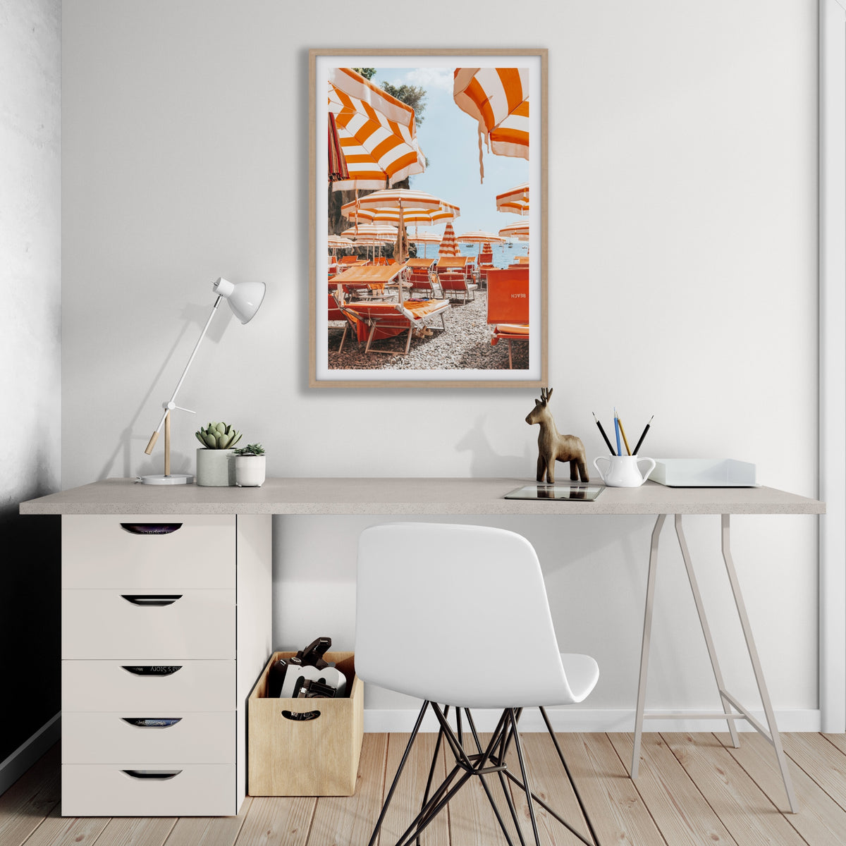 Aperol Summer Positano, orange striped parasols and loungers on a Positano pebble beach, framed print styled in a room view 6