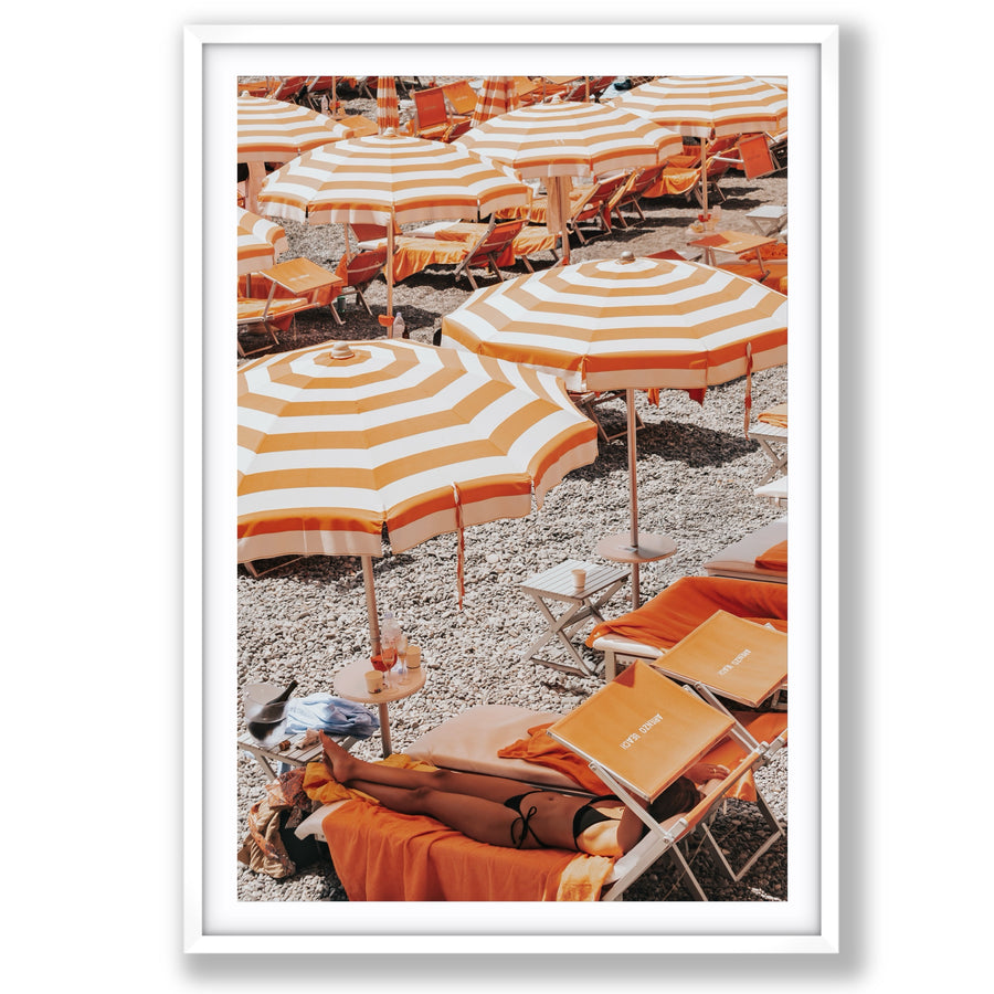 Beach Mode Positano, orange striped umbrellas, loungers and sunbather on pebbles, main fine art print image