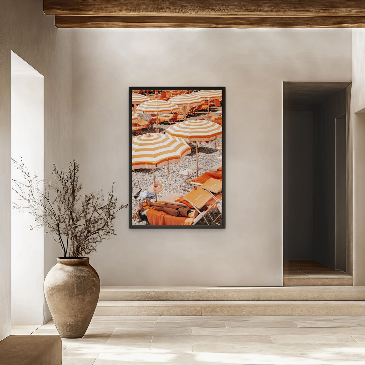 Beach Mode Positano, orange striped umbrellas, loungers and sunbather on pebbles, framed print styled in a room