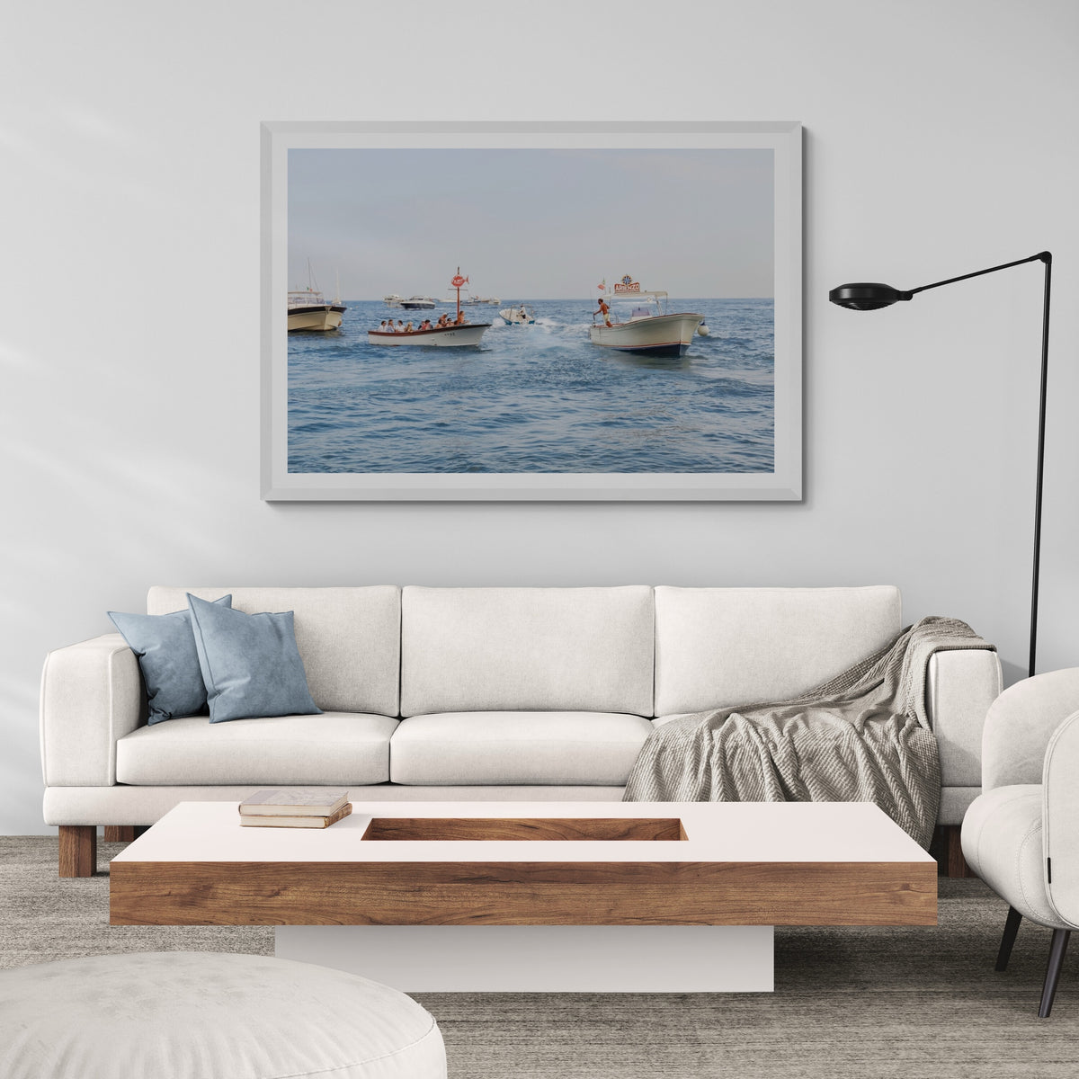 Summer Shuttle Positano, beach club tenders and passengers crossing blue water off Positano, framed print styled in a room